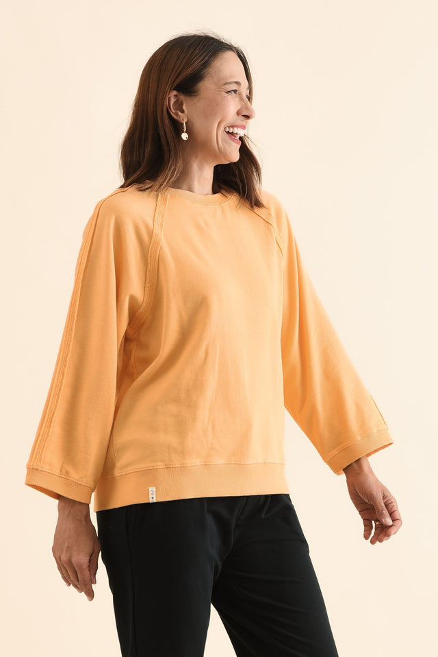 Nessa Peach Cotton Frayed Sweatshirt,Side,Brunette model,alt text|model:Cara image 3