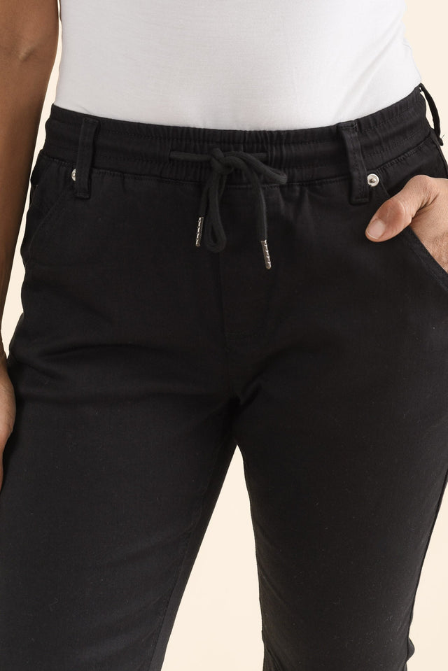 Whistler Black Cotton Jogger Pants,brunette model,Close up of outfit,alt text|model:Cara image 5