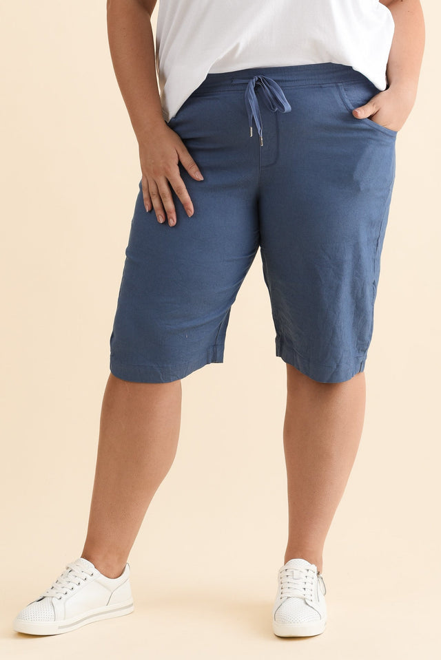 Asha Blue Travel Shorts,Brunette model,plus-size,curve-bottoms,plus-size-shorts,alt text|model:Gabby