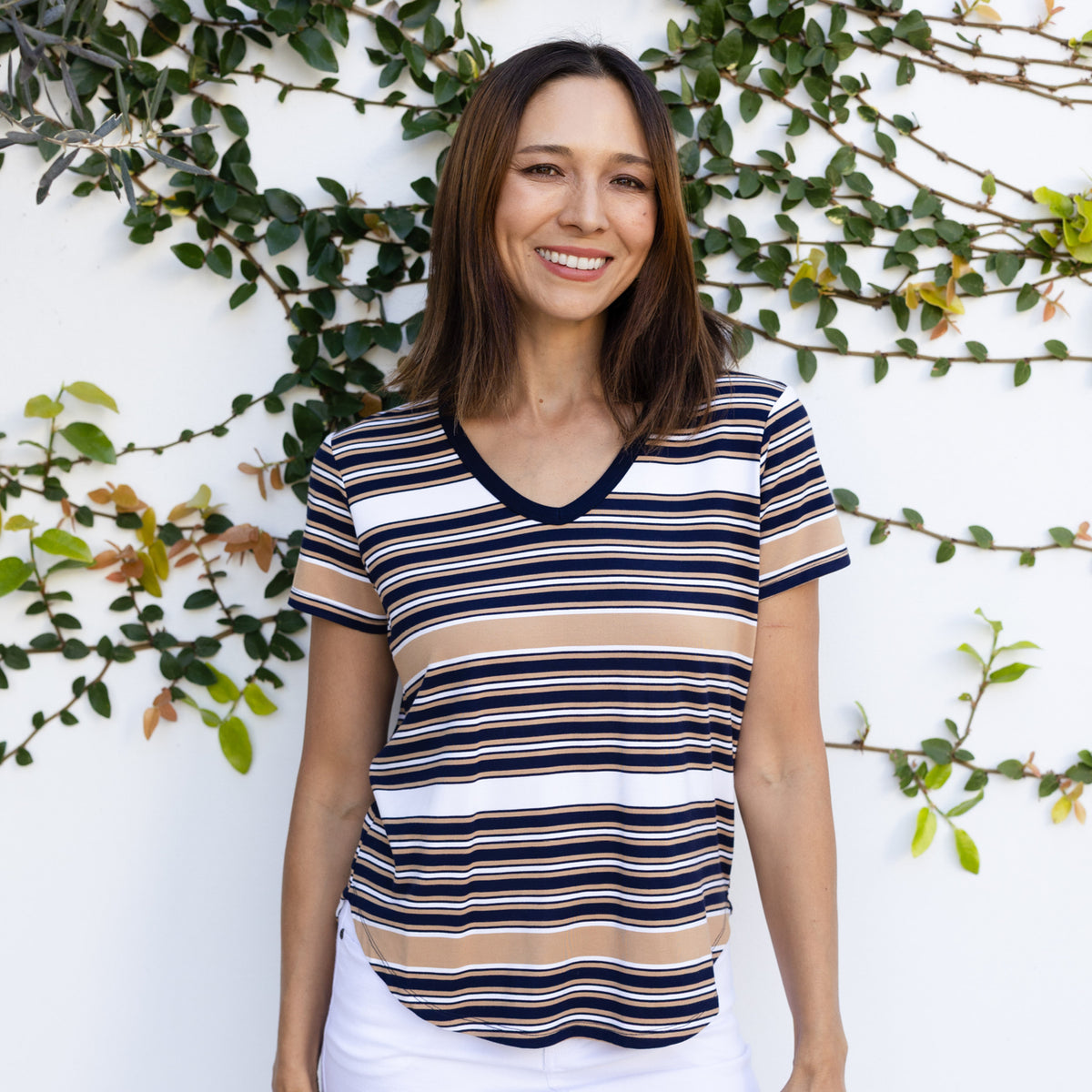 Brunette woman in a stripe tee.