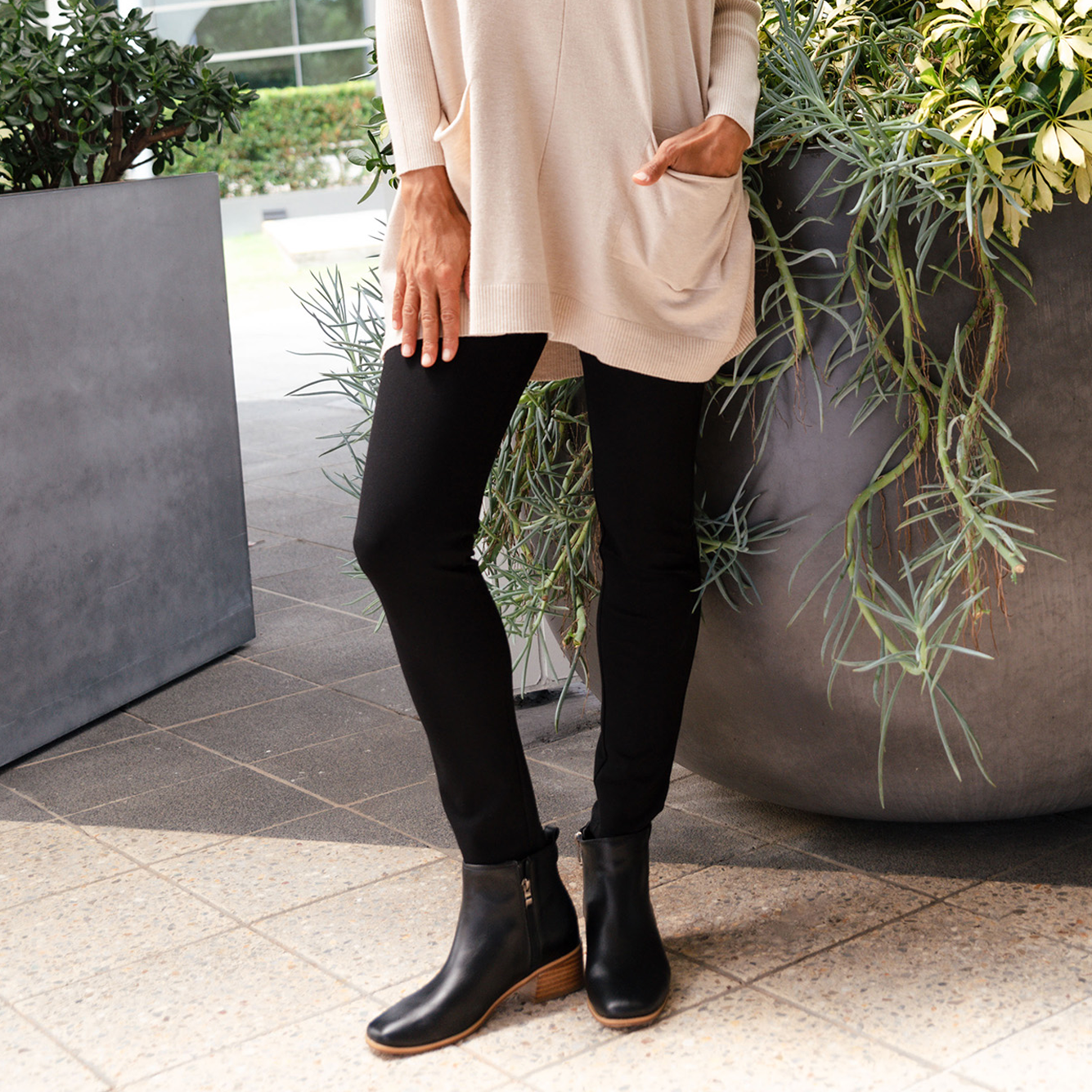 Women wearing black Ponte Pants.
