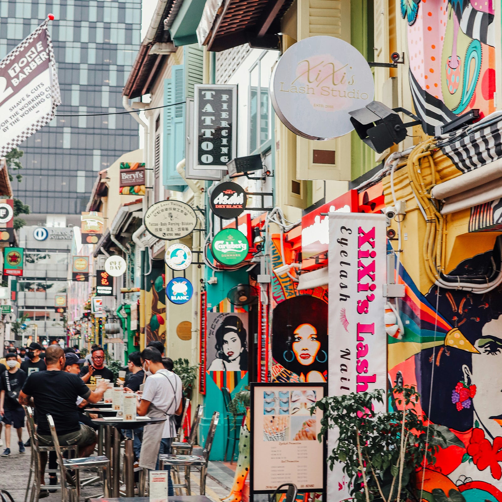Busy Singapore street with colourful signs.