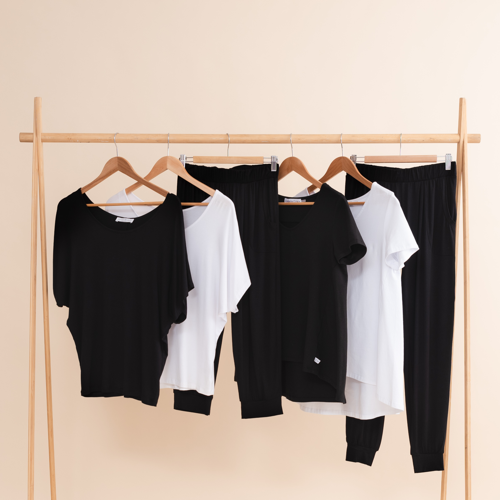 Black travel clothing: black and white tees and pants.